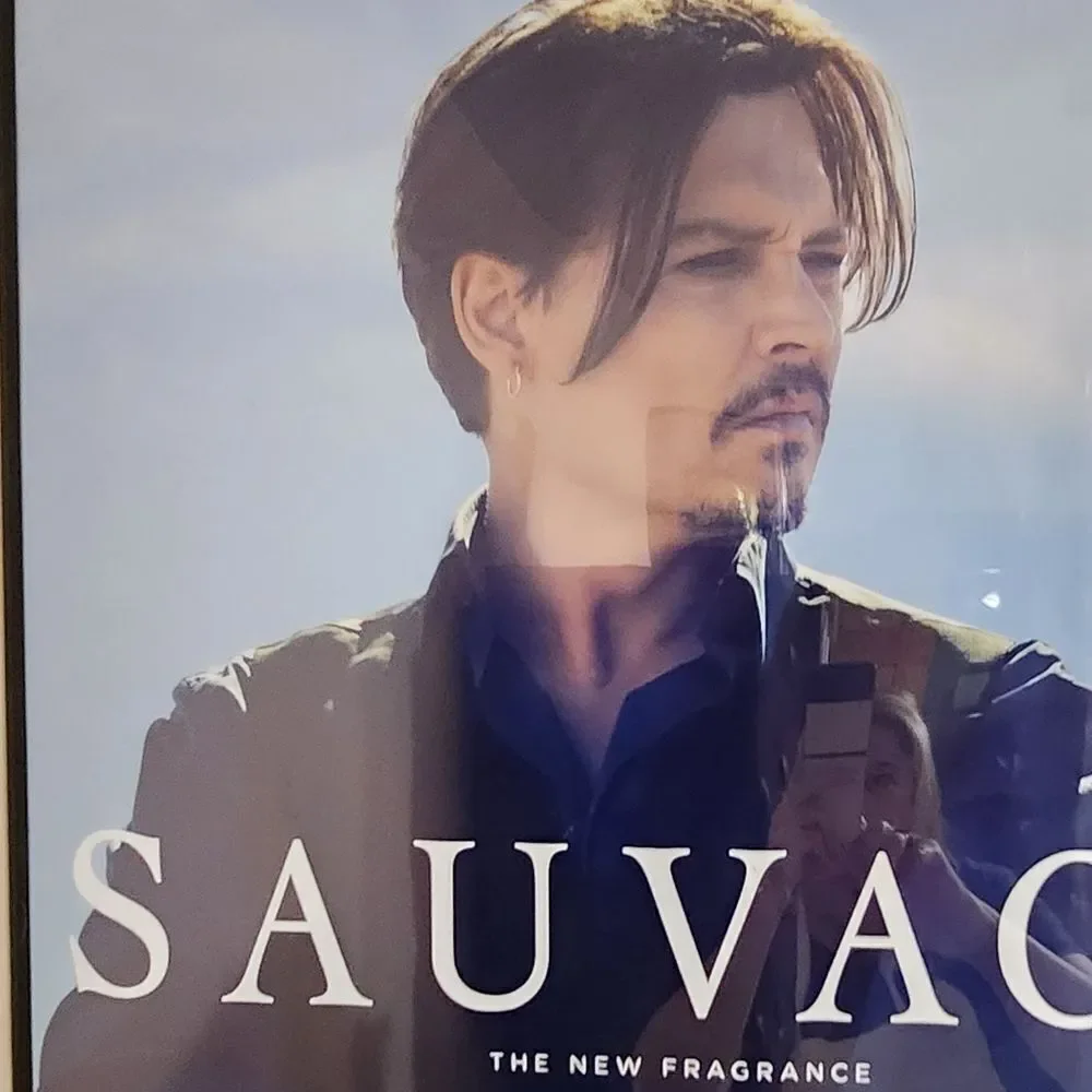 Dior Sauvage Fragrance Advertisement with Blue and Black Accents - Picture 2 of 2